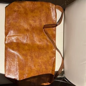 Absolutely new, spacious shoulder bag, faux leather, Brown color. Never used it.